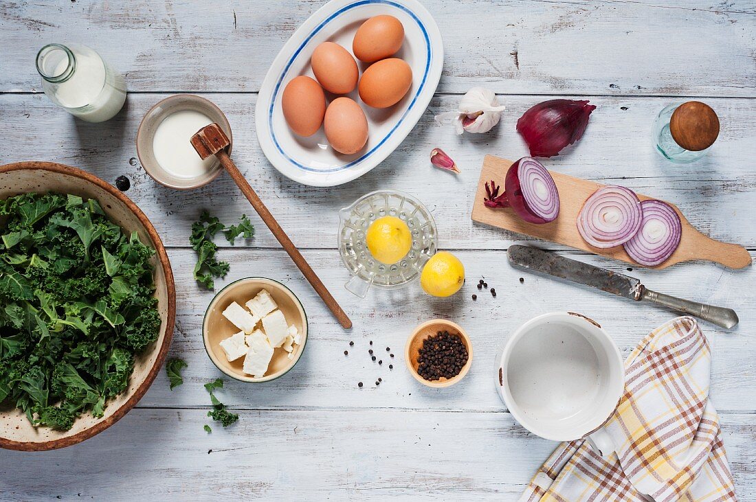 Ingredients for a quiche with kale and feta cheese