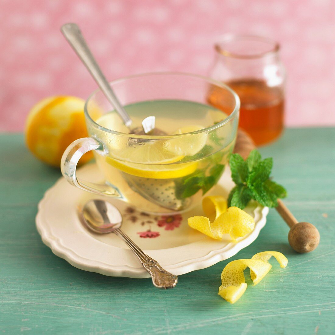 Ginger and lemon tea in a glass teacup