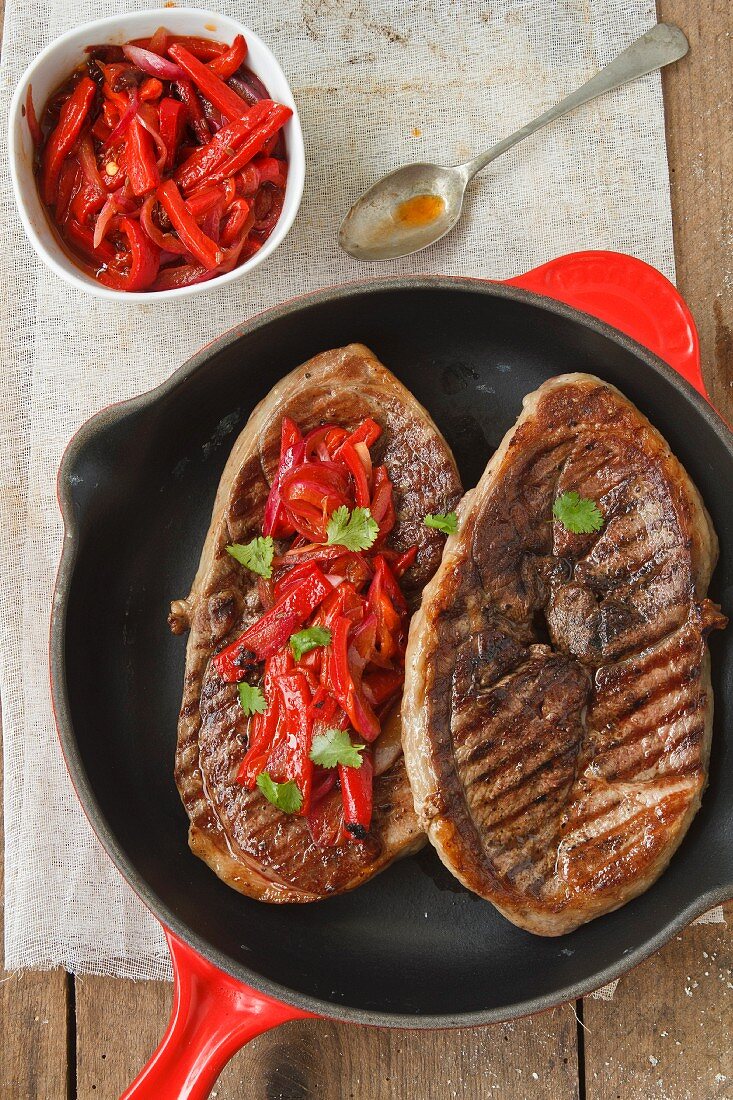 Steaks with red peppers