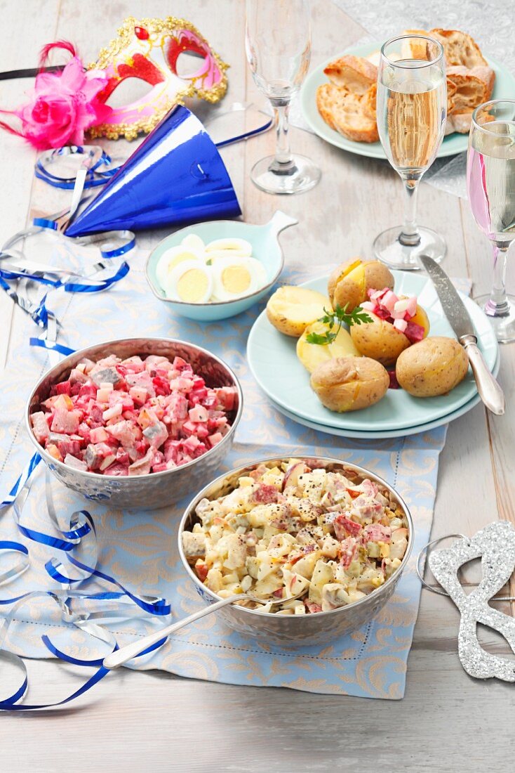 Party buffet with herring salad and accompaniments