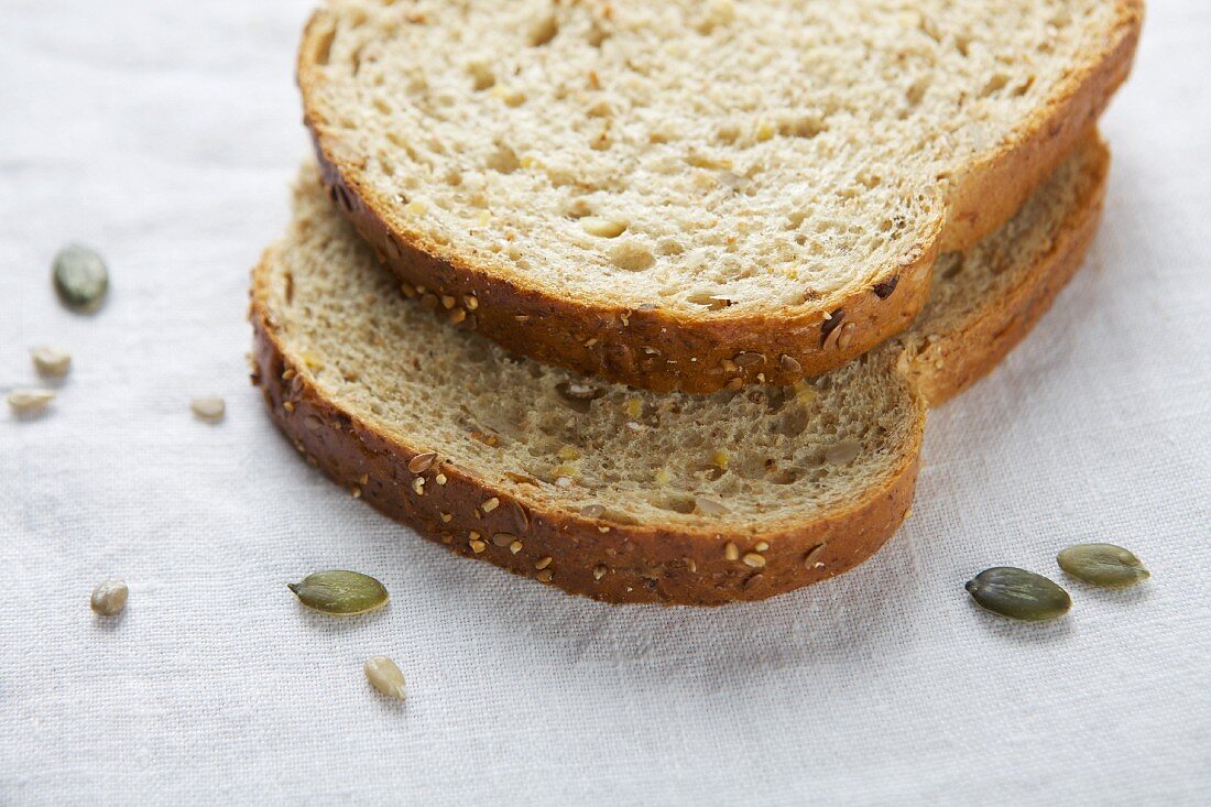 Sliced brown bread with sunflower seeds and pumpkin seeds