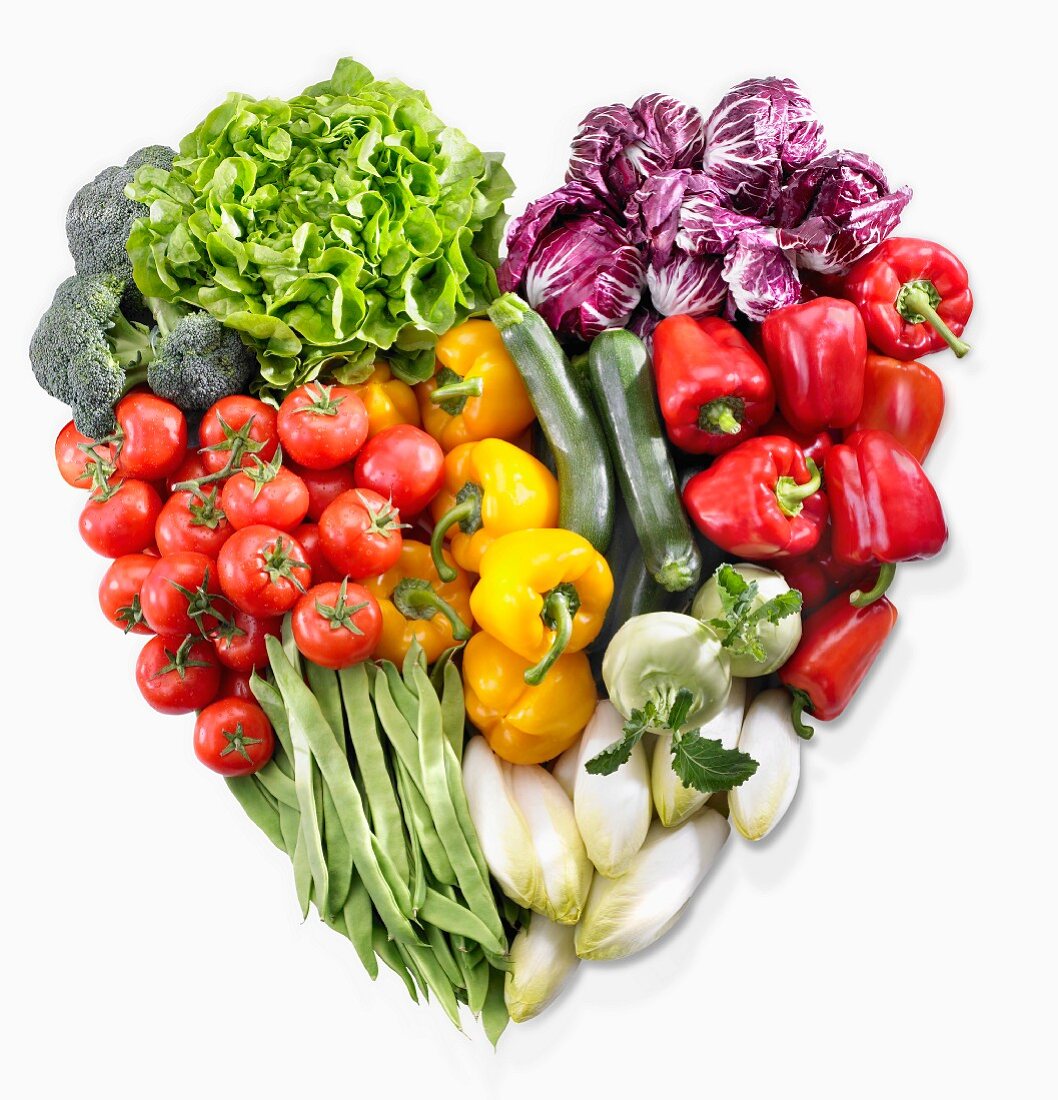 A heart made of vegetables and lettuce