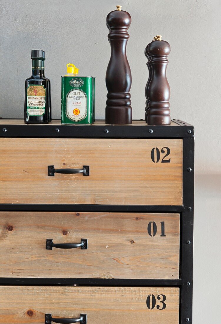 Oil and spice mills on chest of drawers