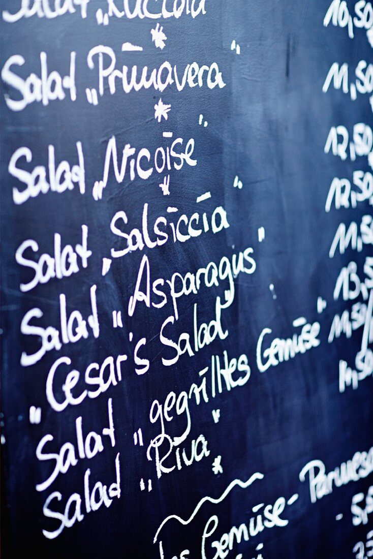Menu with a list of salads in a restaurant