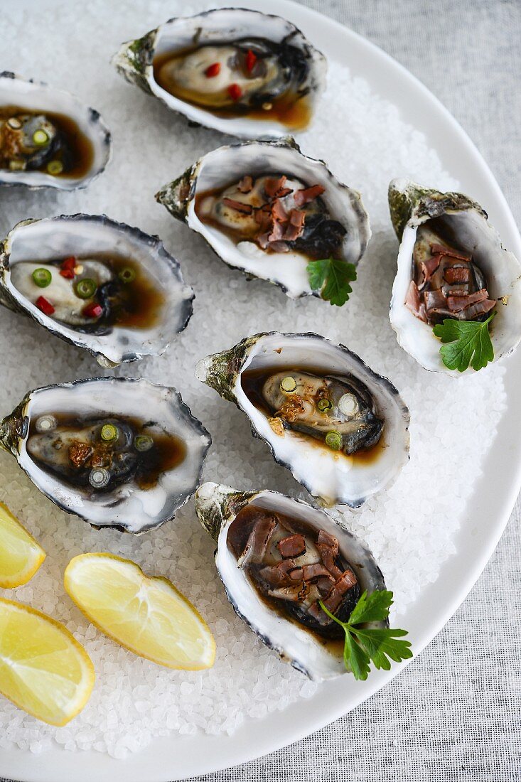 Grilled oysters with assorted dressings