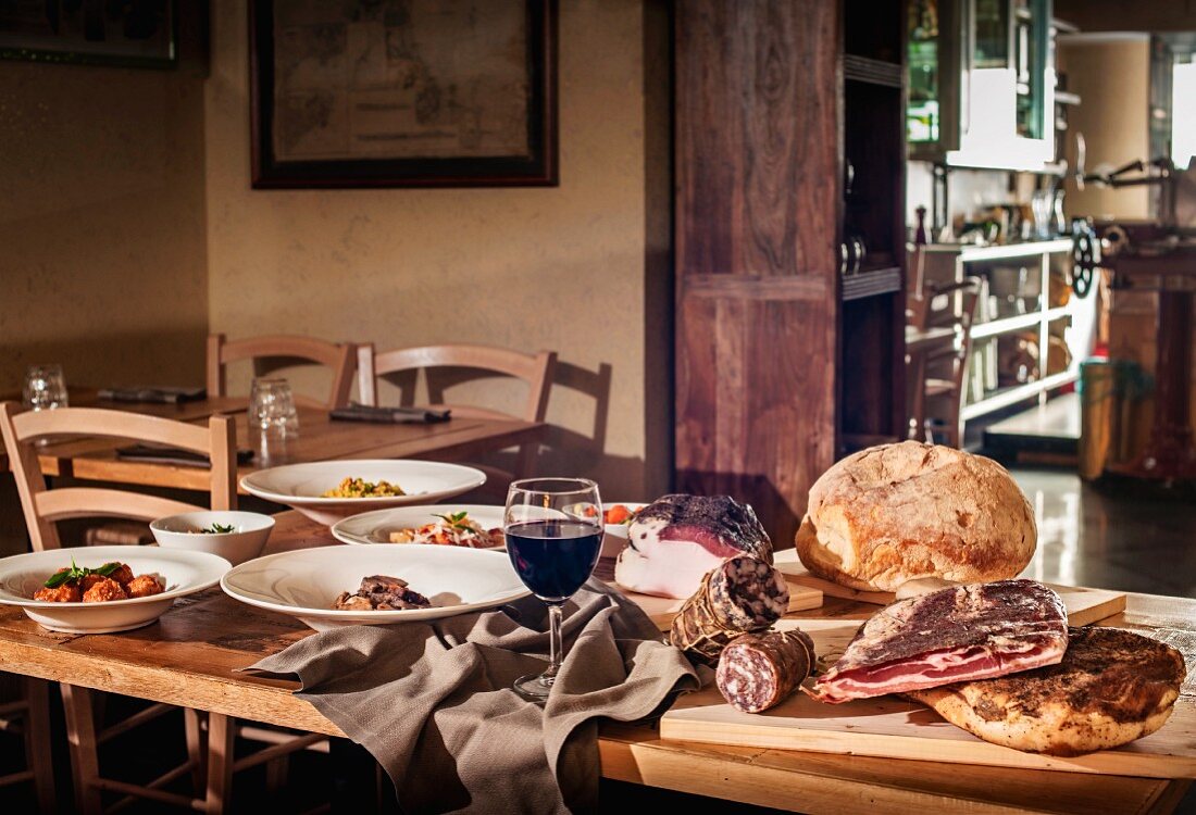 A table laid for a rustic meal in an Italian restaurant