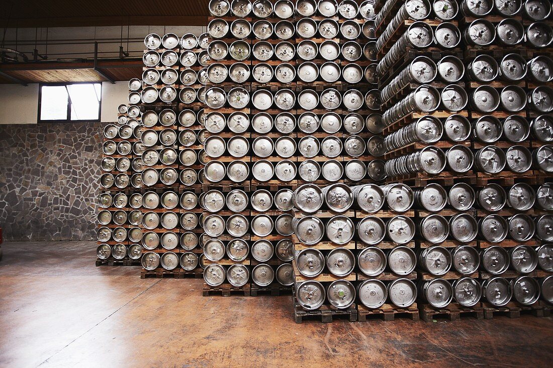 Kegs of beer in storage at a commercial brewery