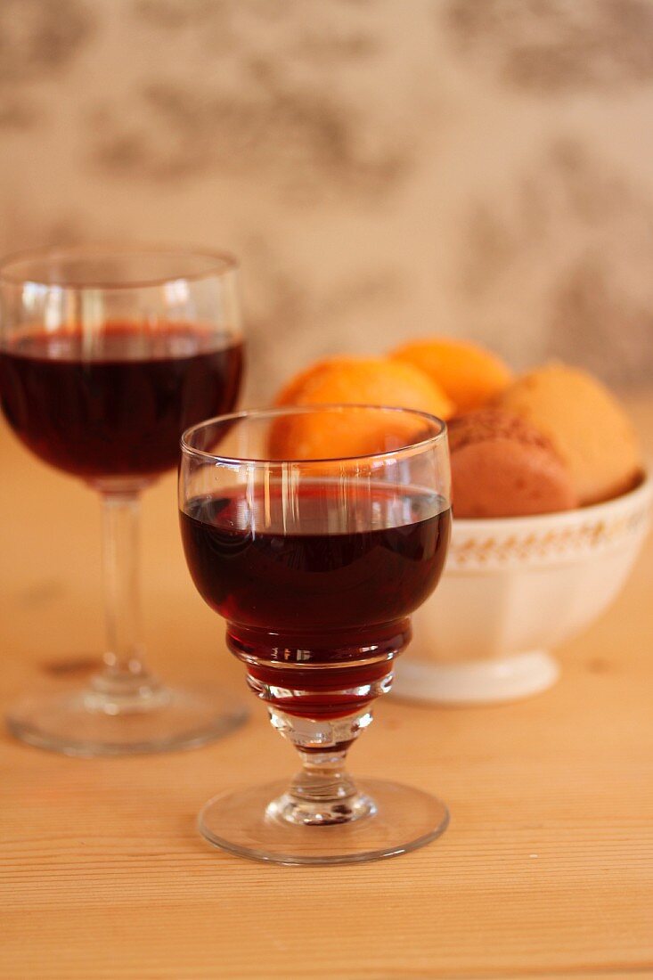 Two glasses of port, served with macaroons