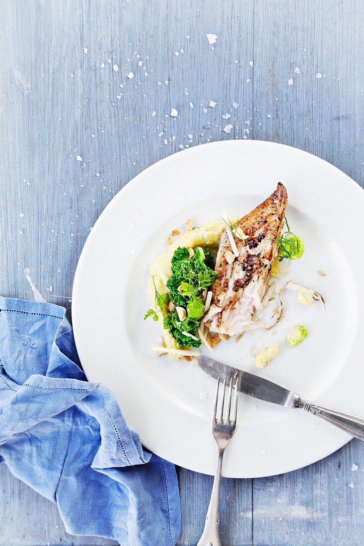 Thornback ray with mashed potatoes, Brussels sprouts, lime, dill, parsley and almonds