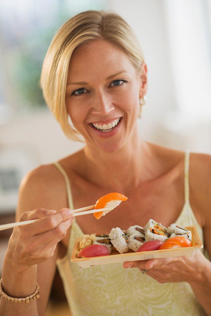 A woman eating sushi