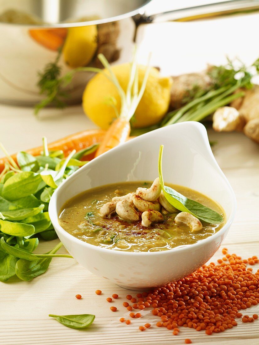 Carrot and lentil soup with spinach and cashew nuts