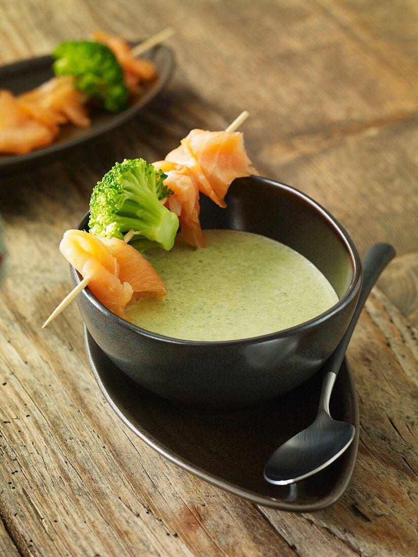 Cream of broccoli soup with a smoked salmon skewer