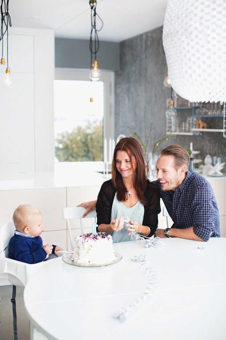 Parents celebrating with son his first birthday