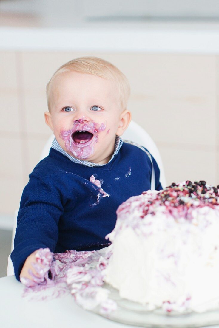Boy eating birthday cake