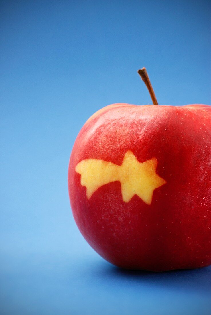 A red apple with a shooting star