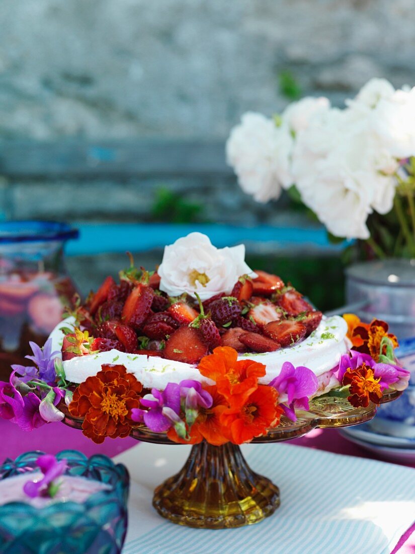 Meringue cake with strawberries on cake stand