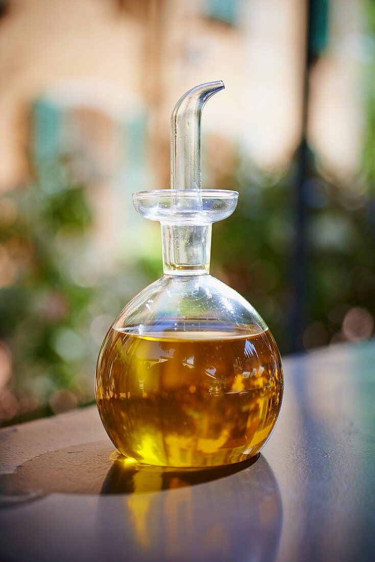 Olive oil in a carafe on the tabletop
