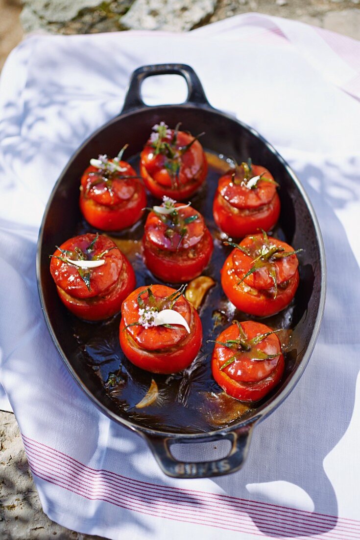Stuffed tomatoes in a roasting pan