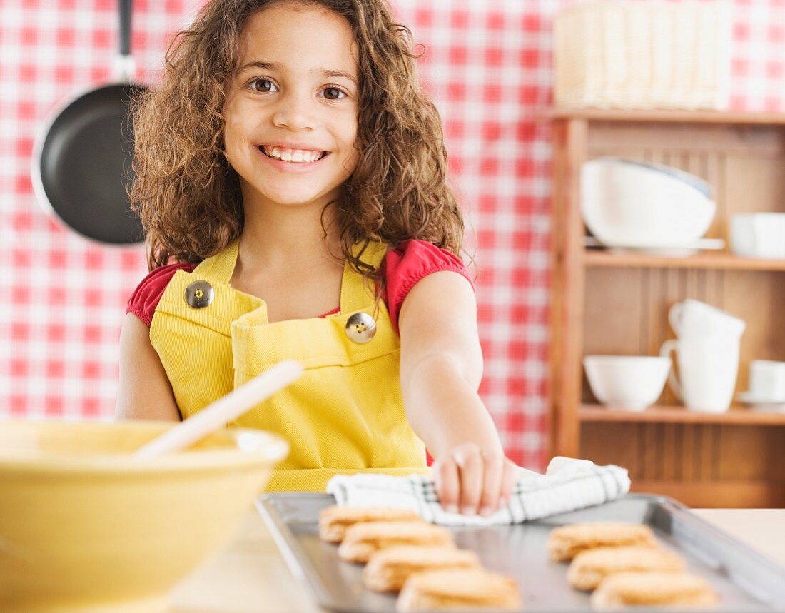 Young girl baking cookies