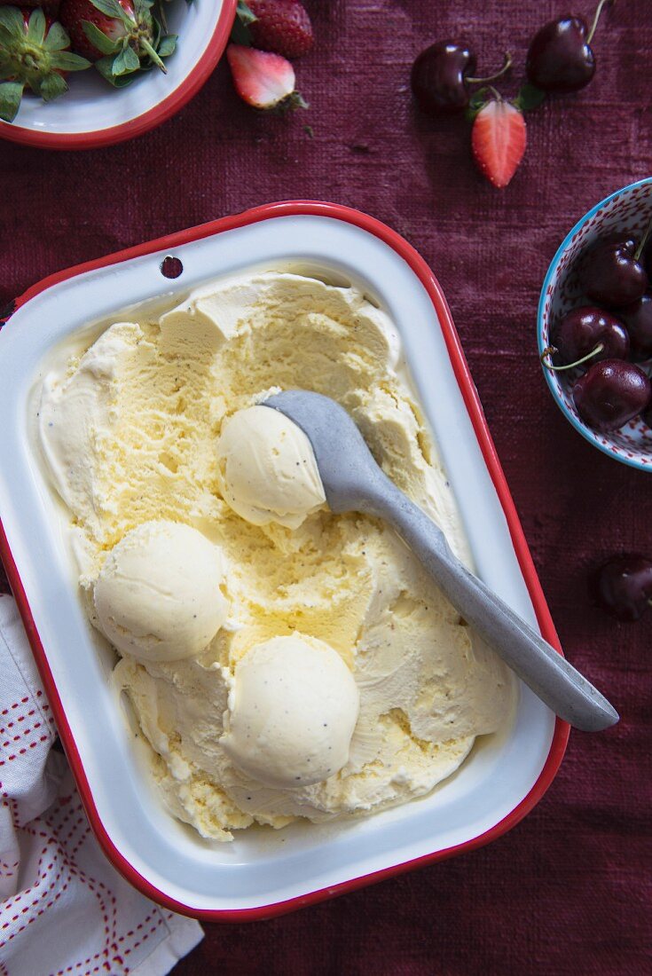 Paleo vanilla ice cream, fresh cherries and strawberries