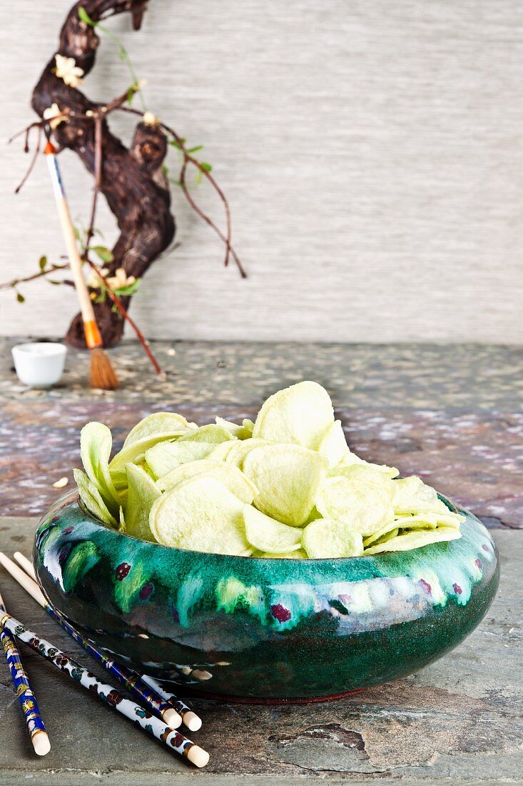 Wasabi flavoured crisps in a ceramic bowl