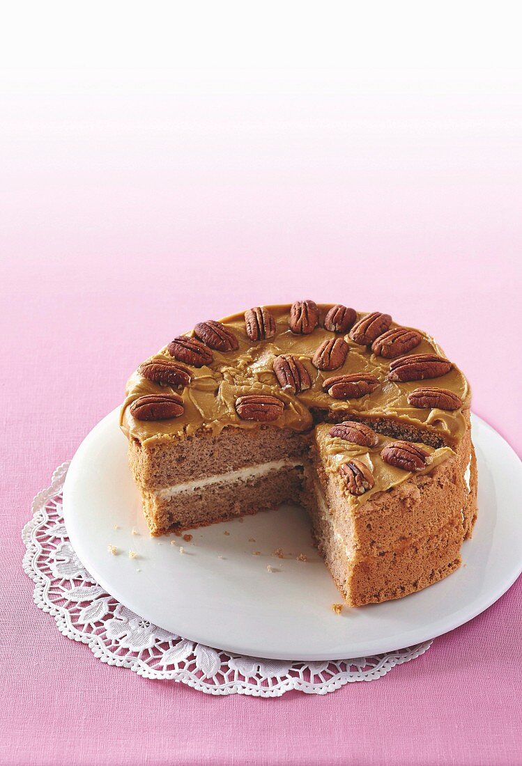 Chai cake with caramel cream and pecan nuts