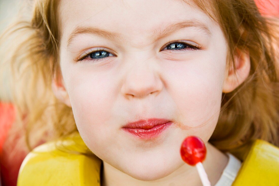 Close-up of Little Girl and Lollipop