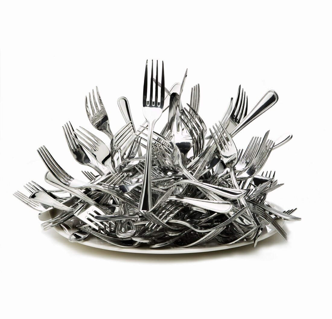 A heap of forks on a plate