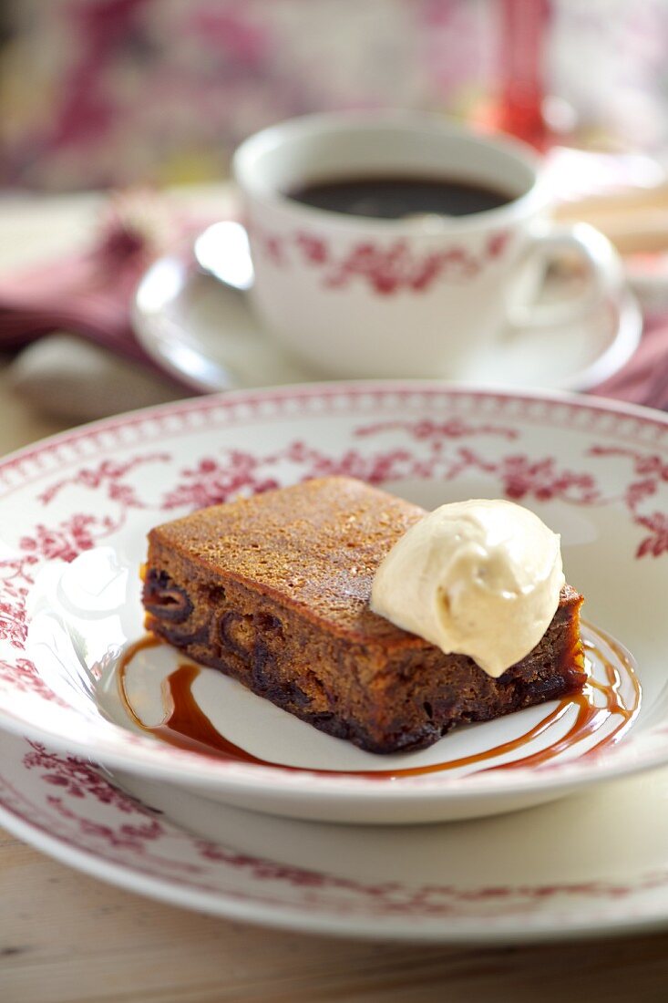 Fruitcake with vanilla ice cream and caramel sauce