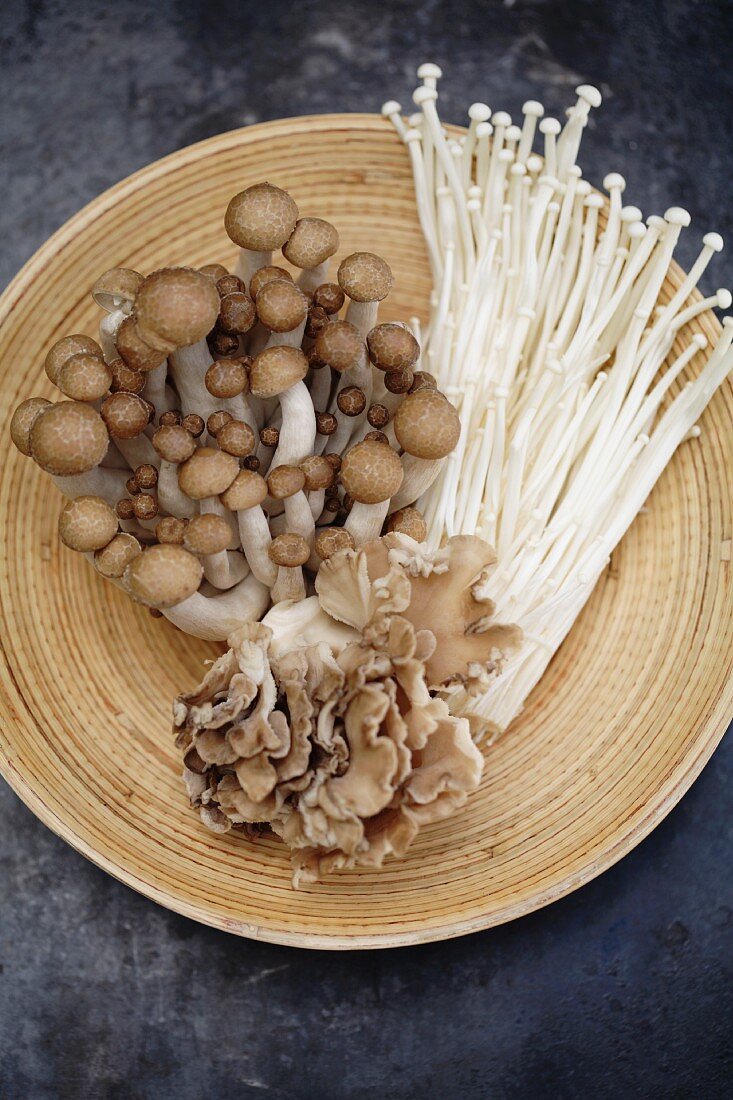 Variety of Asian mushrooms in basket