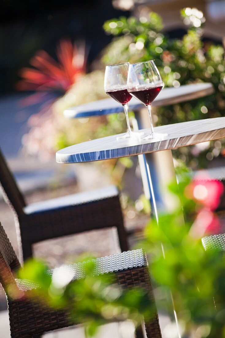 Glasses of red wine on bistro table