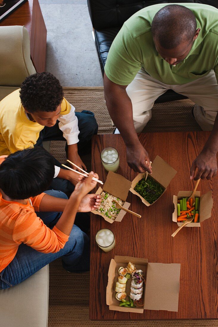 Family eating take-out Asian food