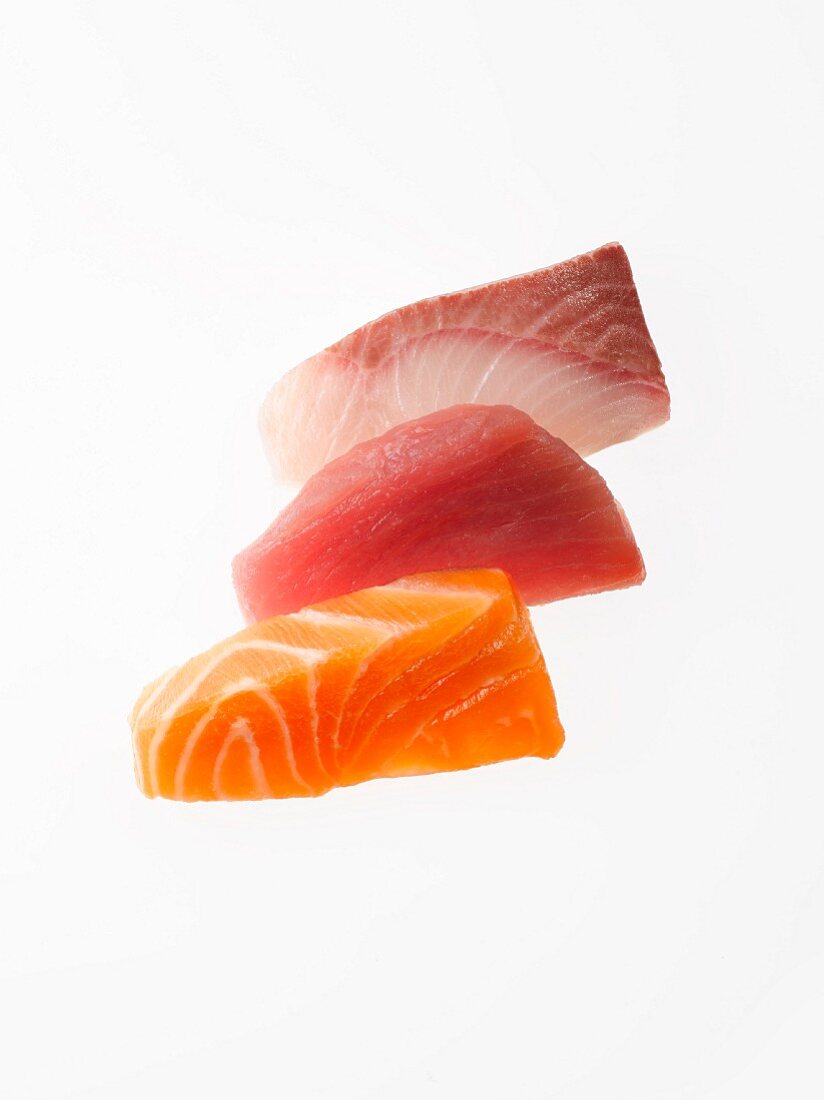 Three slices of raw tuna, salmon and yellowtail for Sashimi