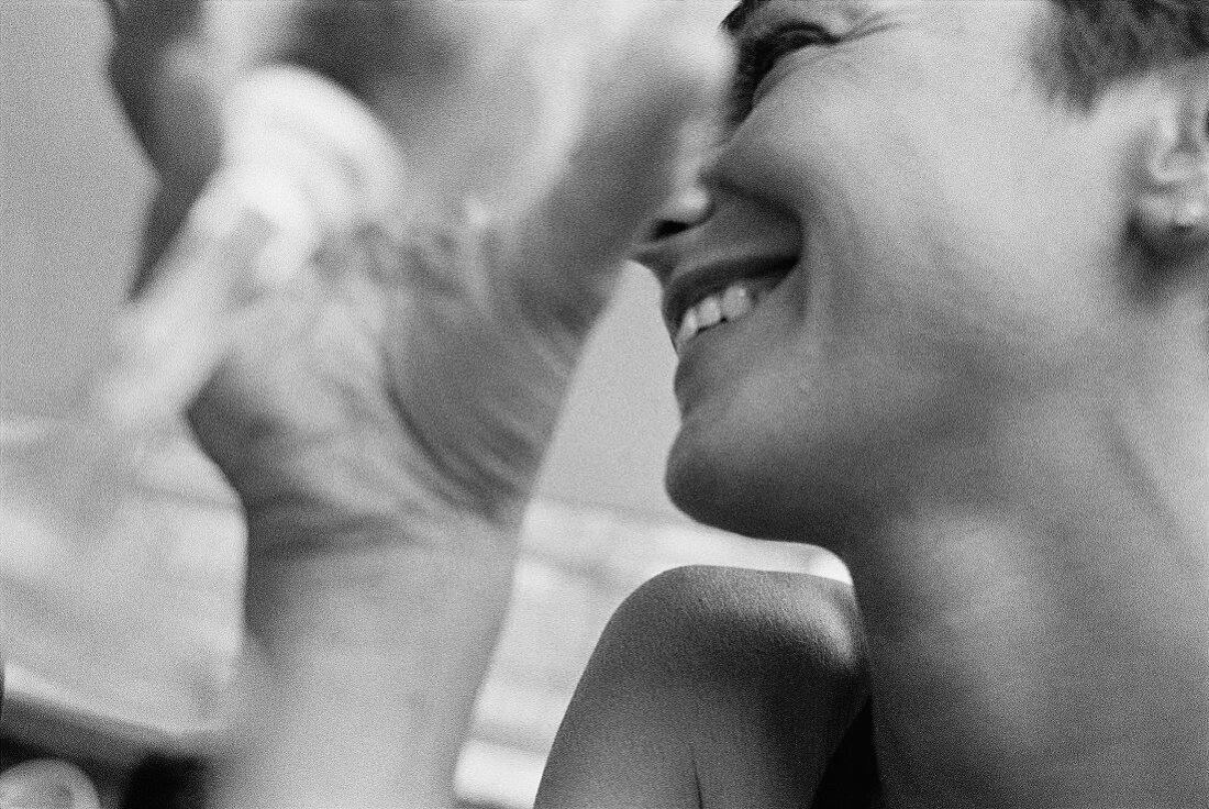 Smiling Woman Holding Glass of Wine