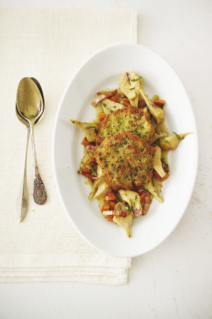 Lammschnitzel mit Kräuterpanade und Artischocken