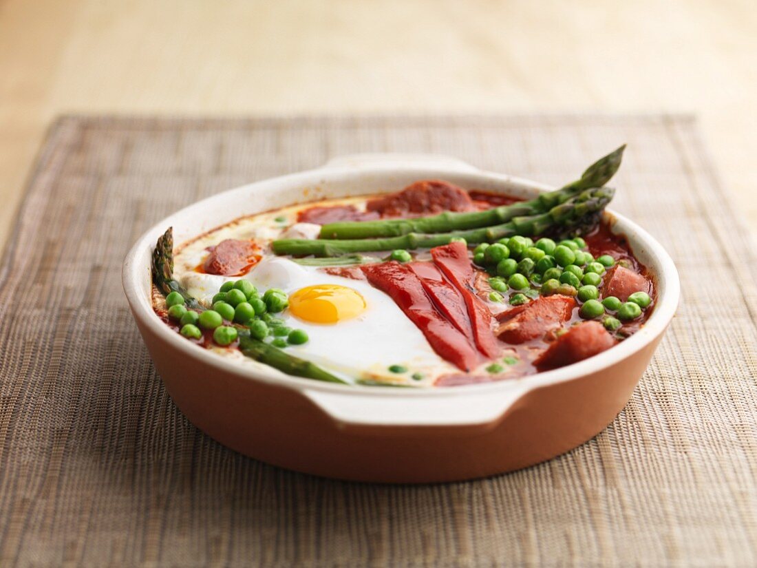 Baked eggs red pepper asparagus peas and chorizo