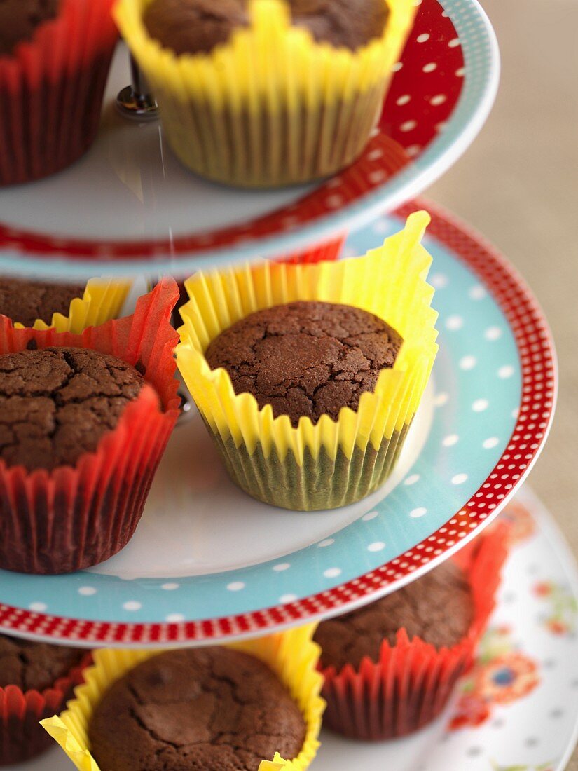 Gluten-free chocolate muffins on a tiered cake stand