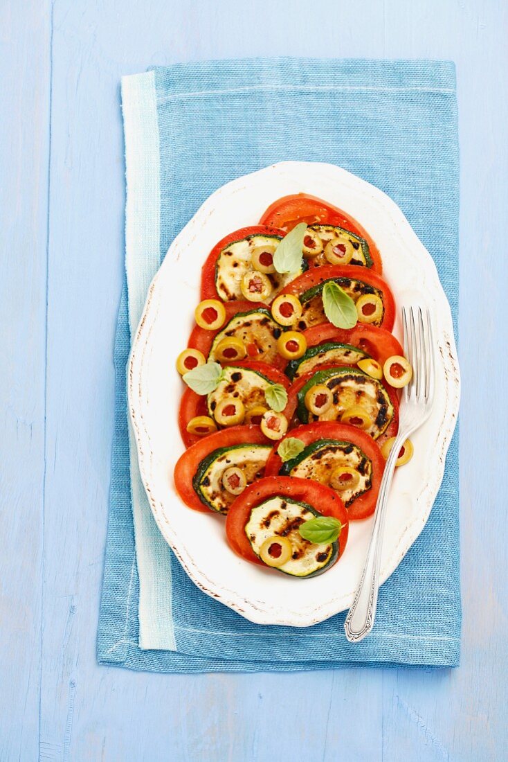 Tomato salad with olives and grilled courgette