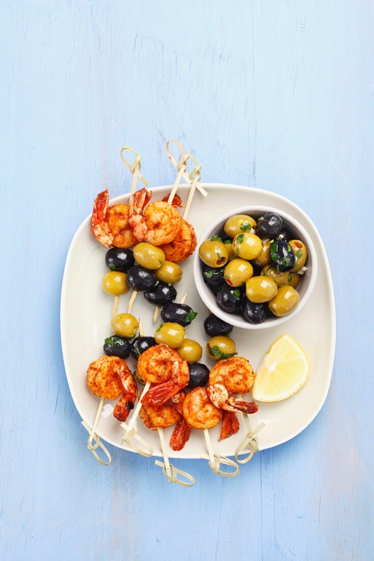 Prawn and olive skewers and marinated olives