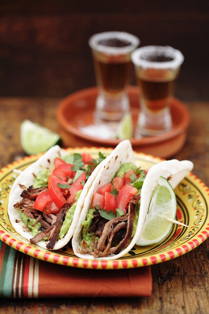 Shredded beef tacos and tequila shots
