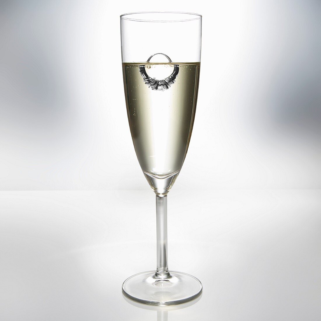 Diamond Ring Floating in Glass of Champagne