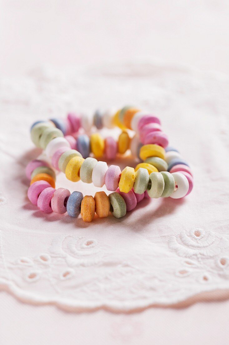 Colourful candy bracelets on a doily