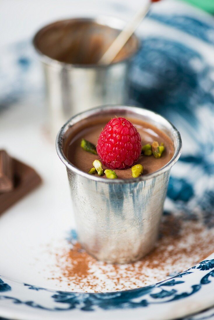 Chocolate and raspberry mousse in a vintage metal pot