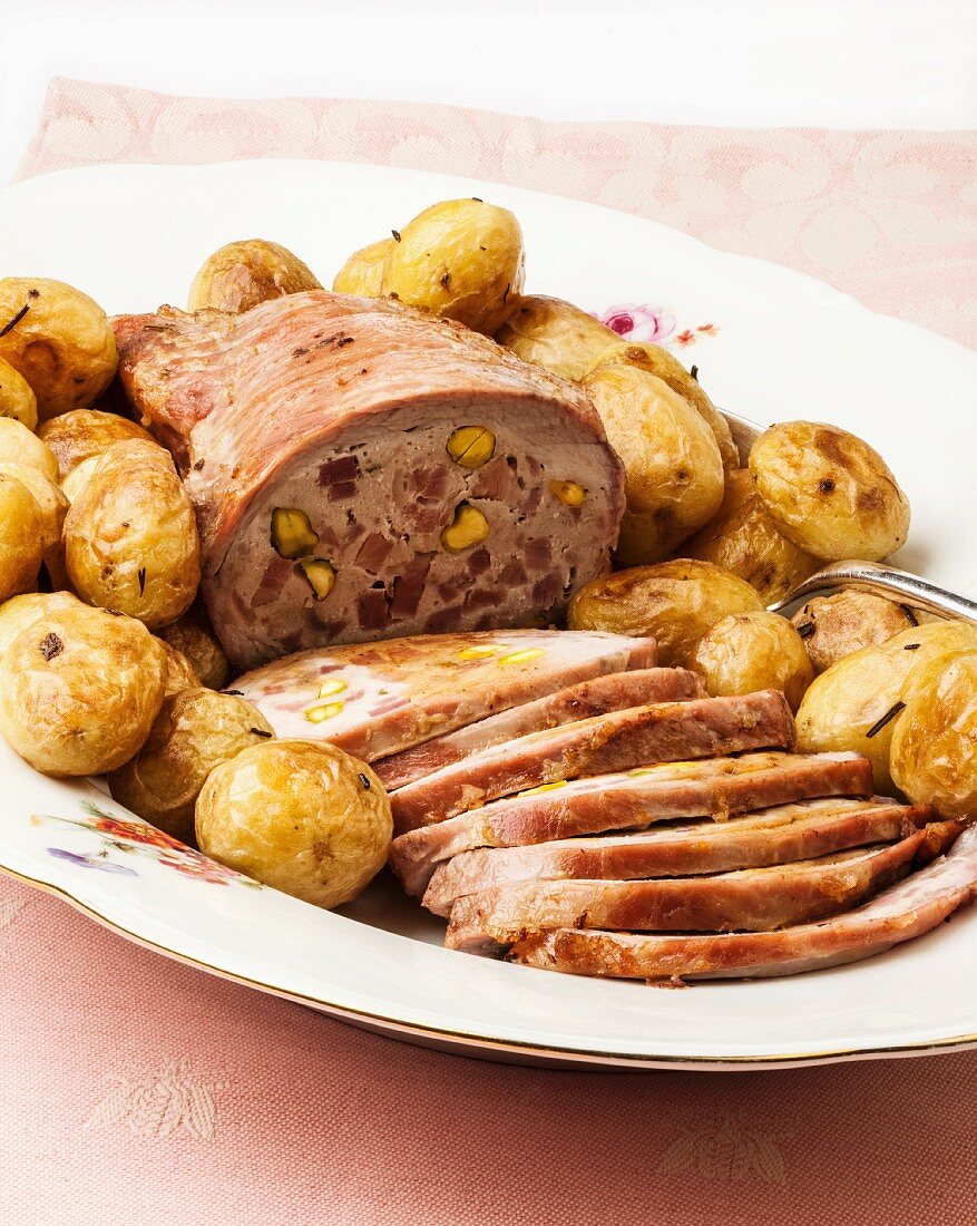 Roasted stuffed beef with potatoes