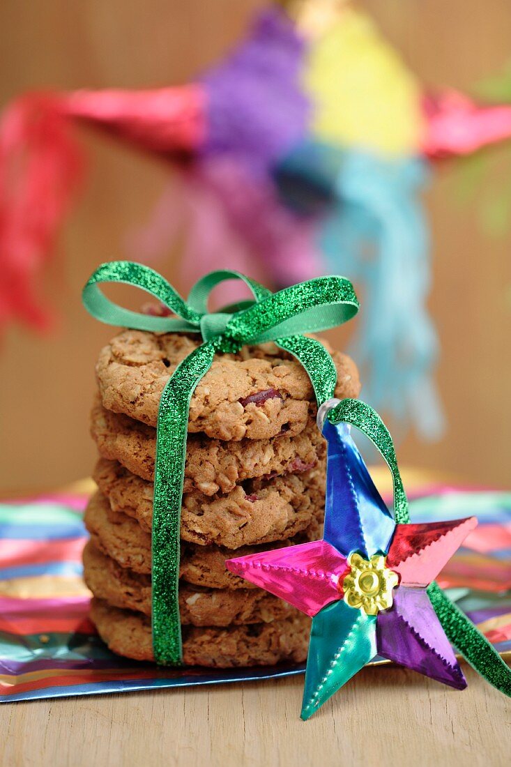 A stack of cookies tied with a ribbon and decorated with a star