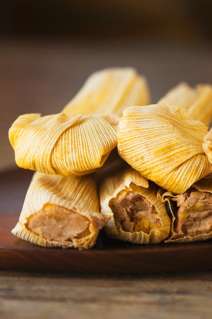 Stack of wrapped corn tamales