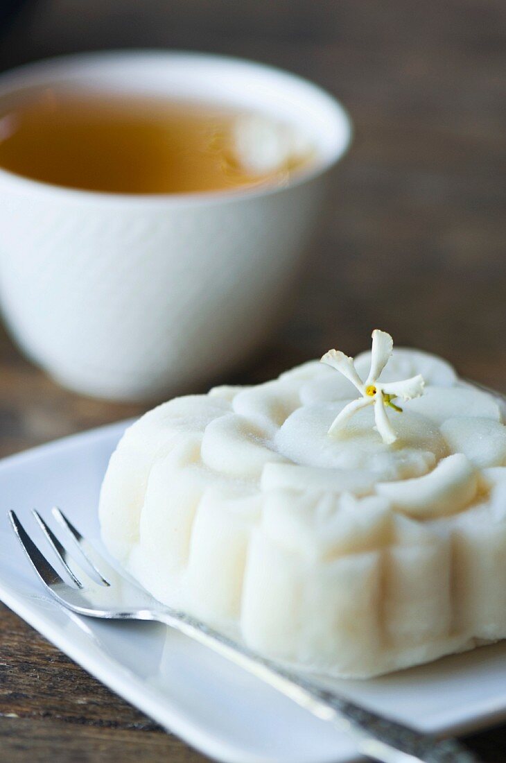A rice cake and a cup of jasmine tea
