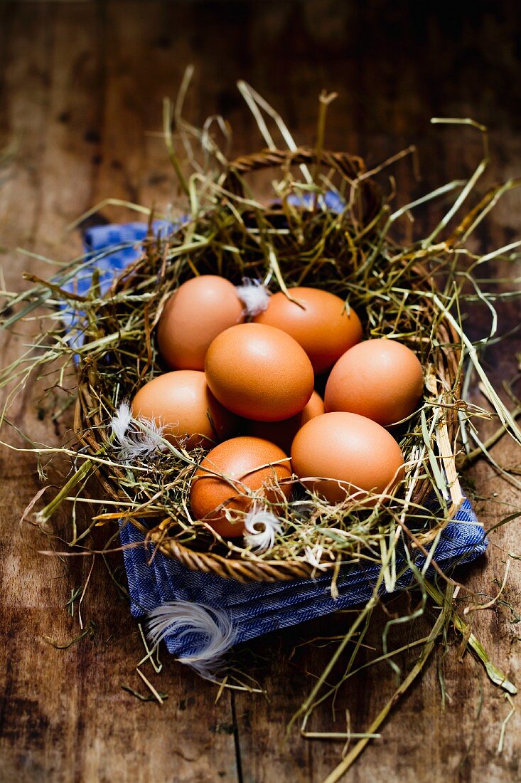 A basket of fresh brown eggs
