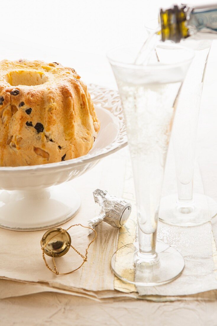 A Bundt cake and champagne glasses