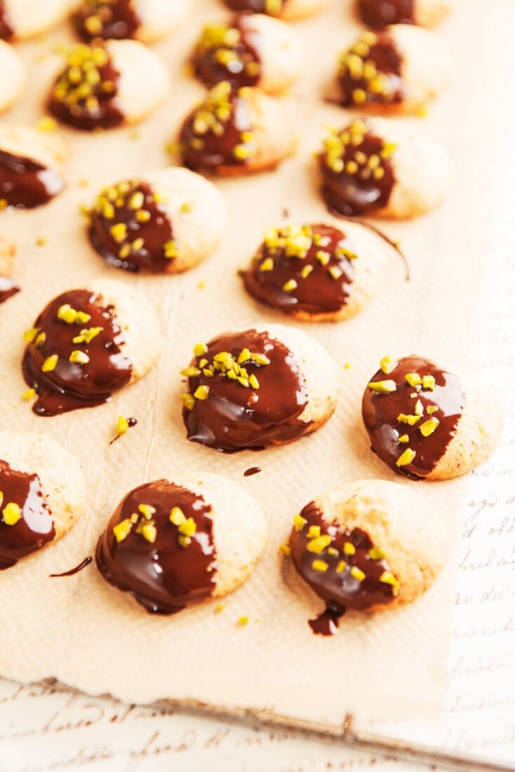 Biscuits with chocolate glaze and pistachio nuts